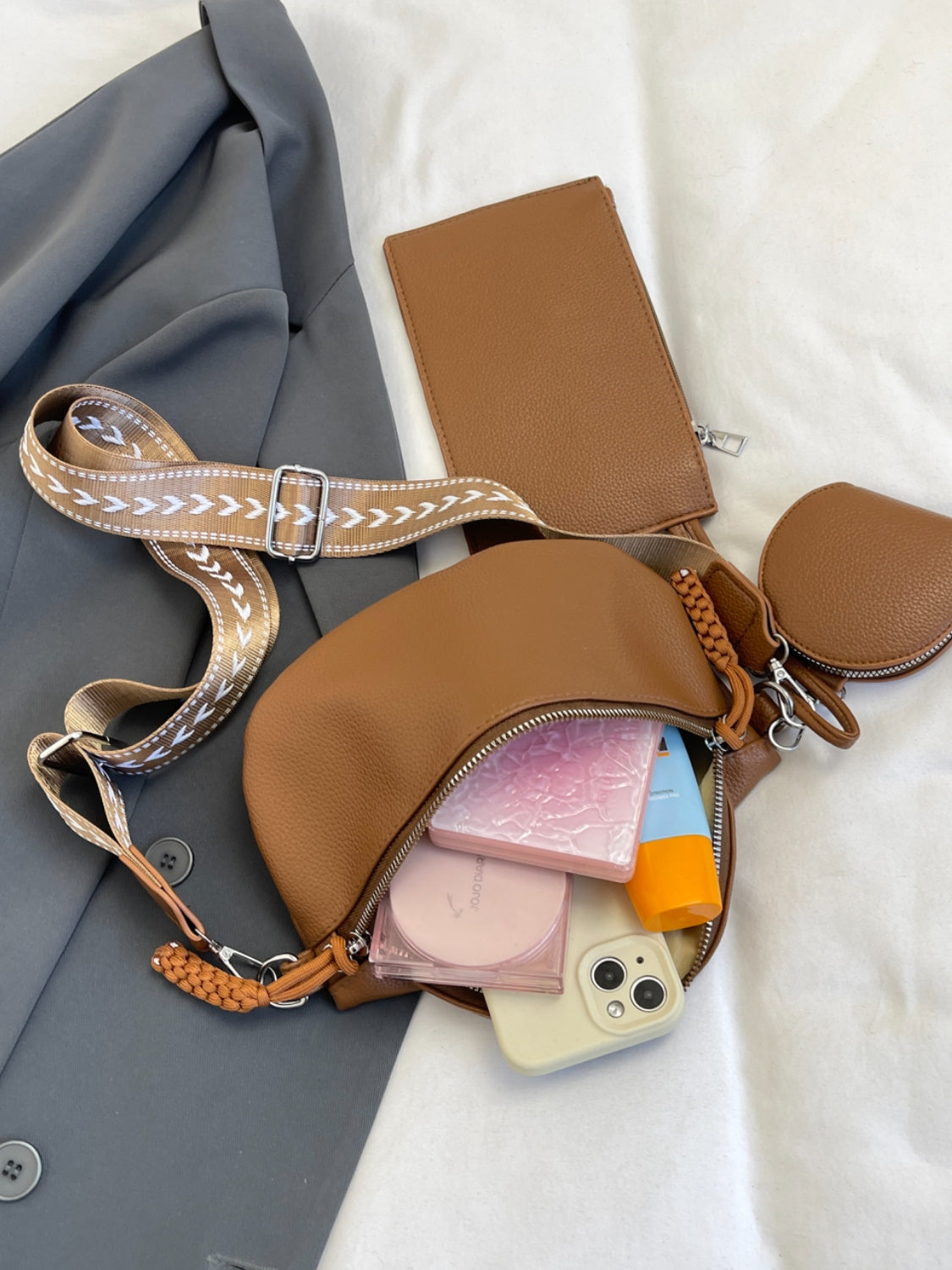 Medium PU leather crossbody bag with adjustable strap and coin purse.