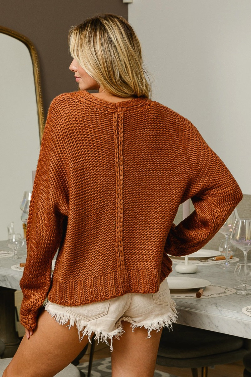 Cinnamon V Neck Cable Sweater with textured cable knit design.