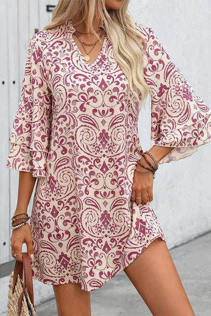 Pink paisley print mini dress with tiered 3/4 sleeves and notched neck.