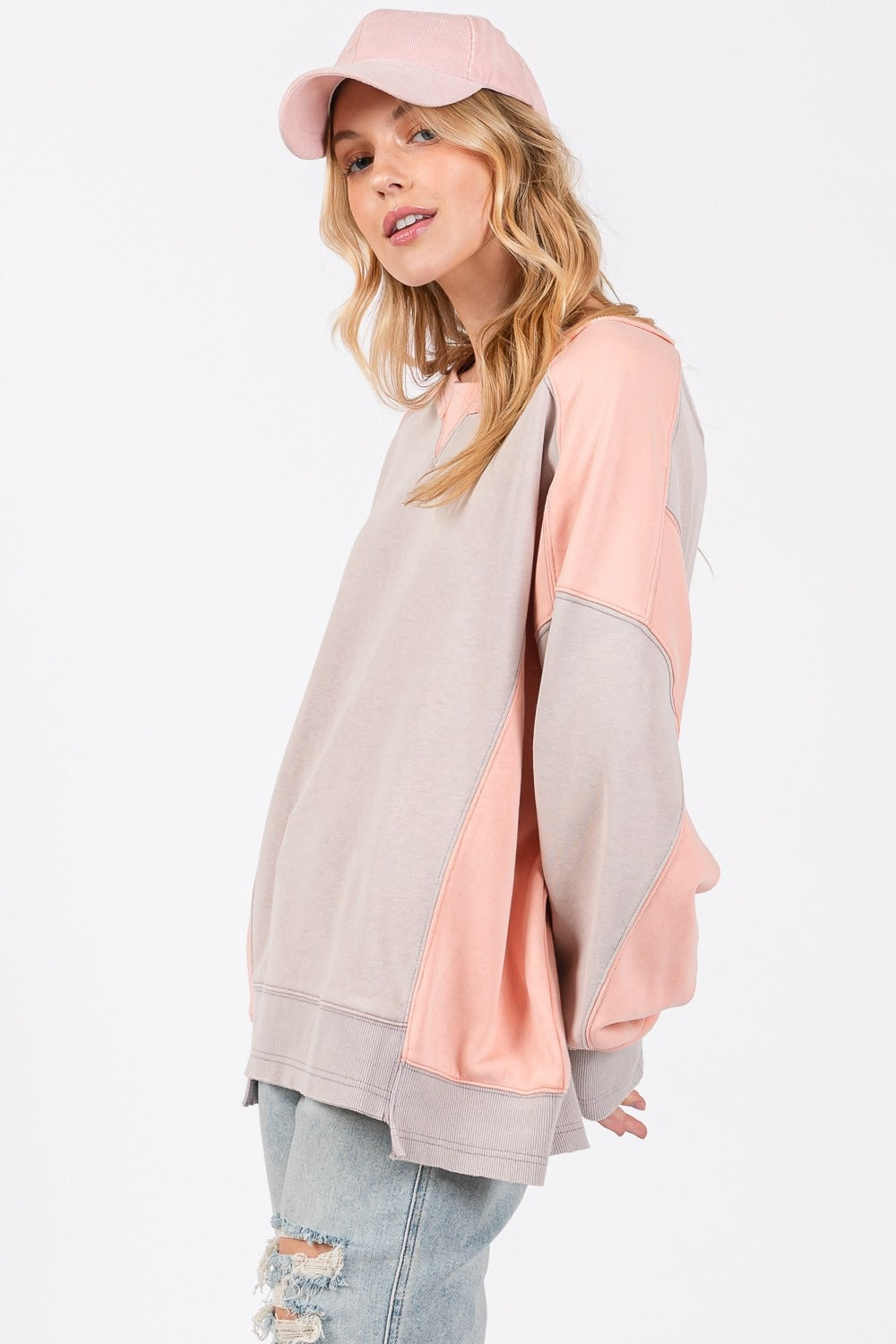 Color block round neck relaxed fit sweatshirt with dropped sleeves and ribbed trim.