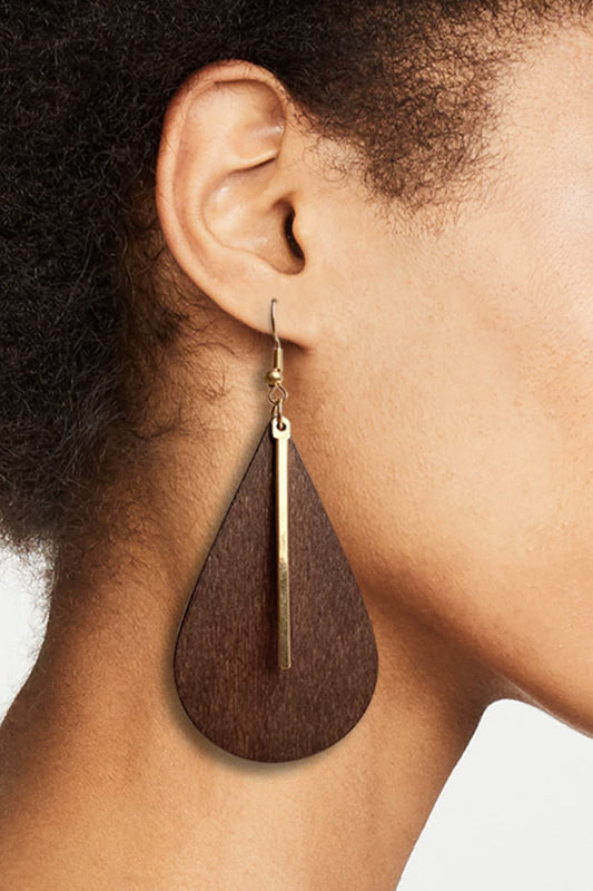 Geometrical shape wooden dangle earrings on woman, boho chic jewelry.