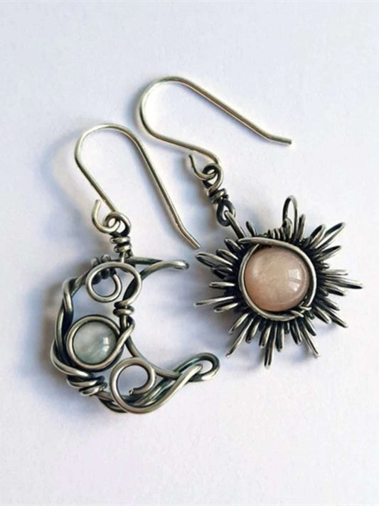 Moon & Sun dangle earrings made of moonstone and alloy.