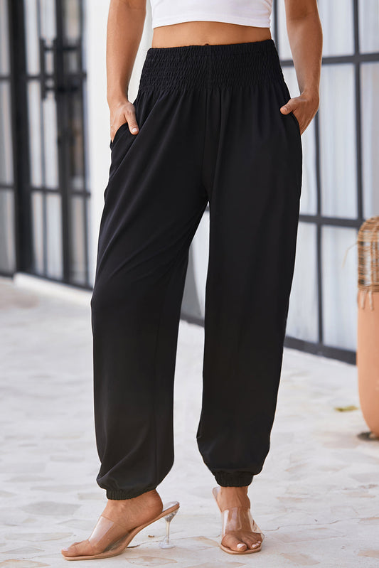 Smocked high waist joggers with elastic ankle design.