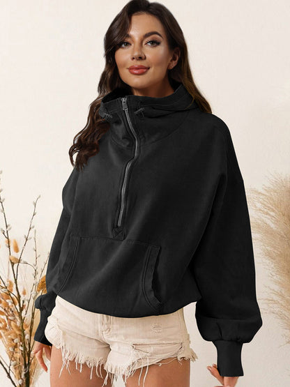 Black zip-up dropped shoulder hoodie with drawstring and pocket, polyester-rayon blend.