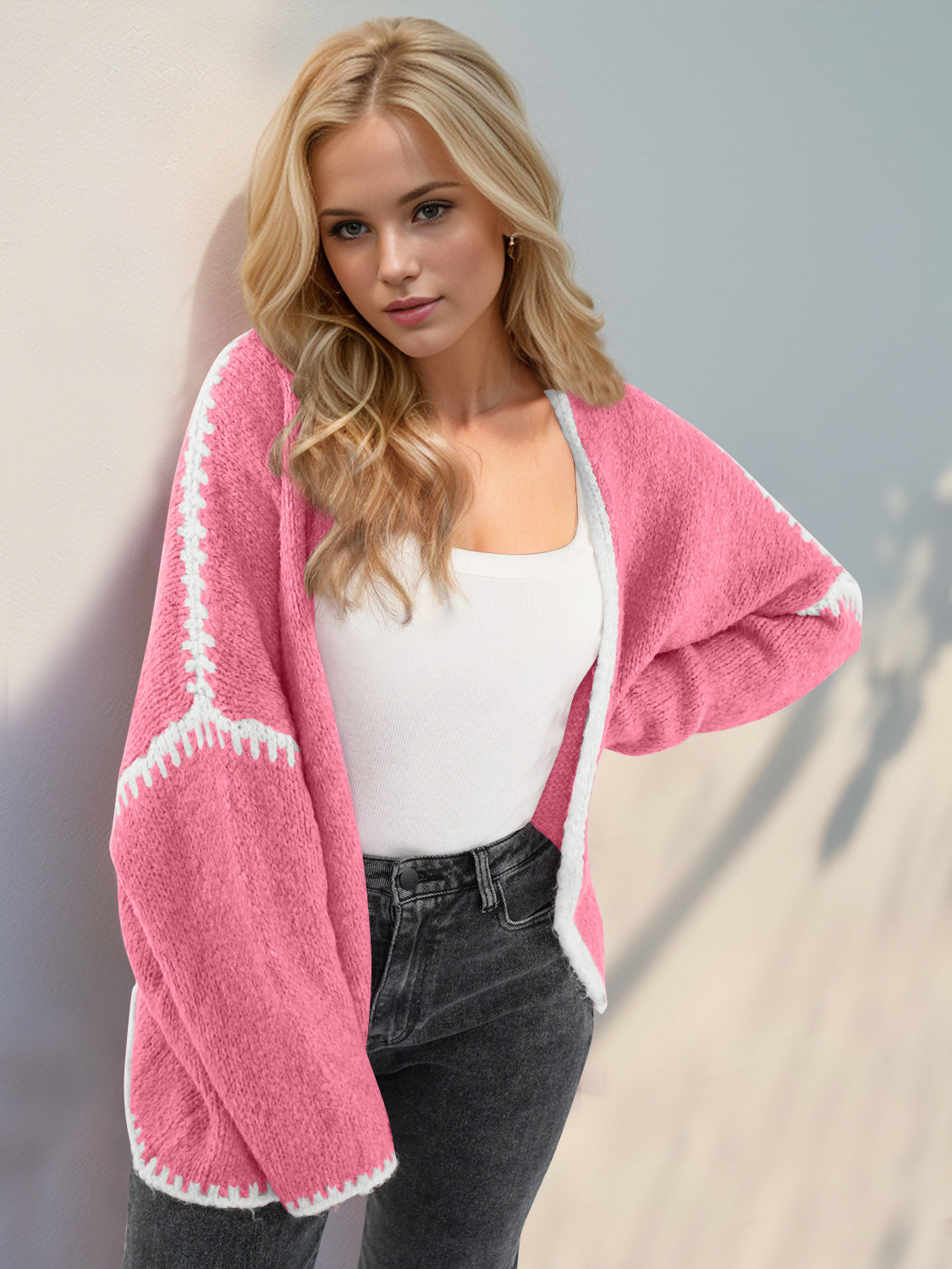 Super Cozy Open Cardigan in pink with white trim, slightly stretchy, ideal for casual wear.