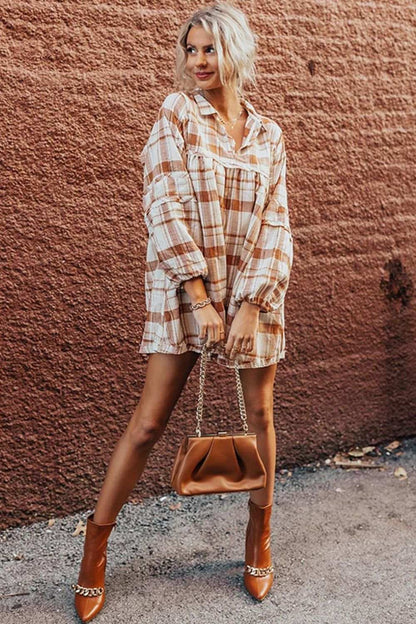 Plaid collared neck long sleeve mini shirt dress on model, paired with brown boots and bag.