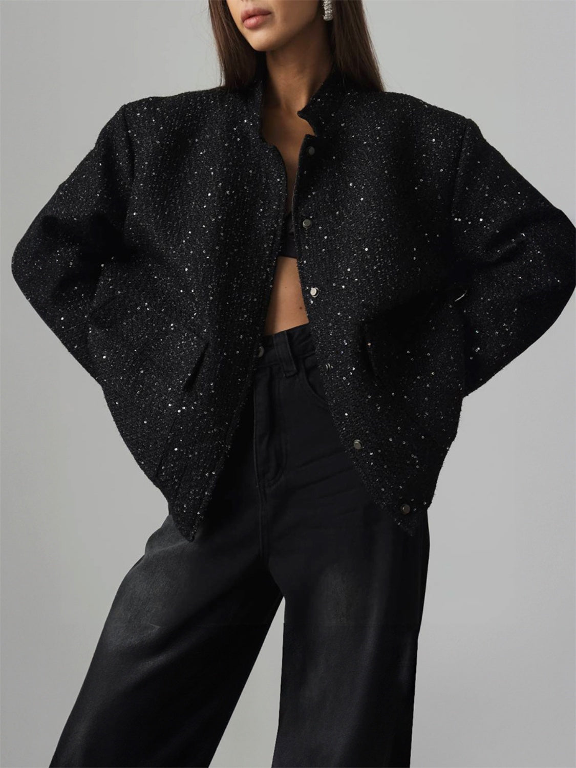 Sequin detailed black long sleeve jacket with pockets, worn by a model.