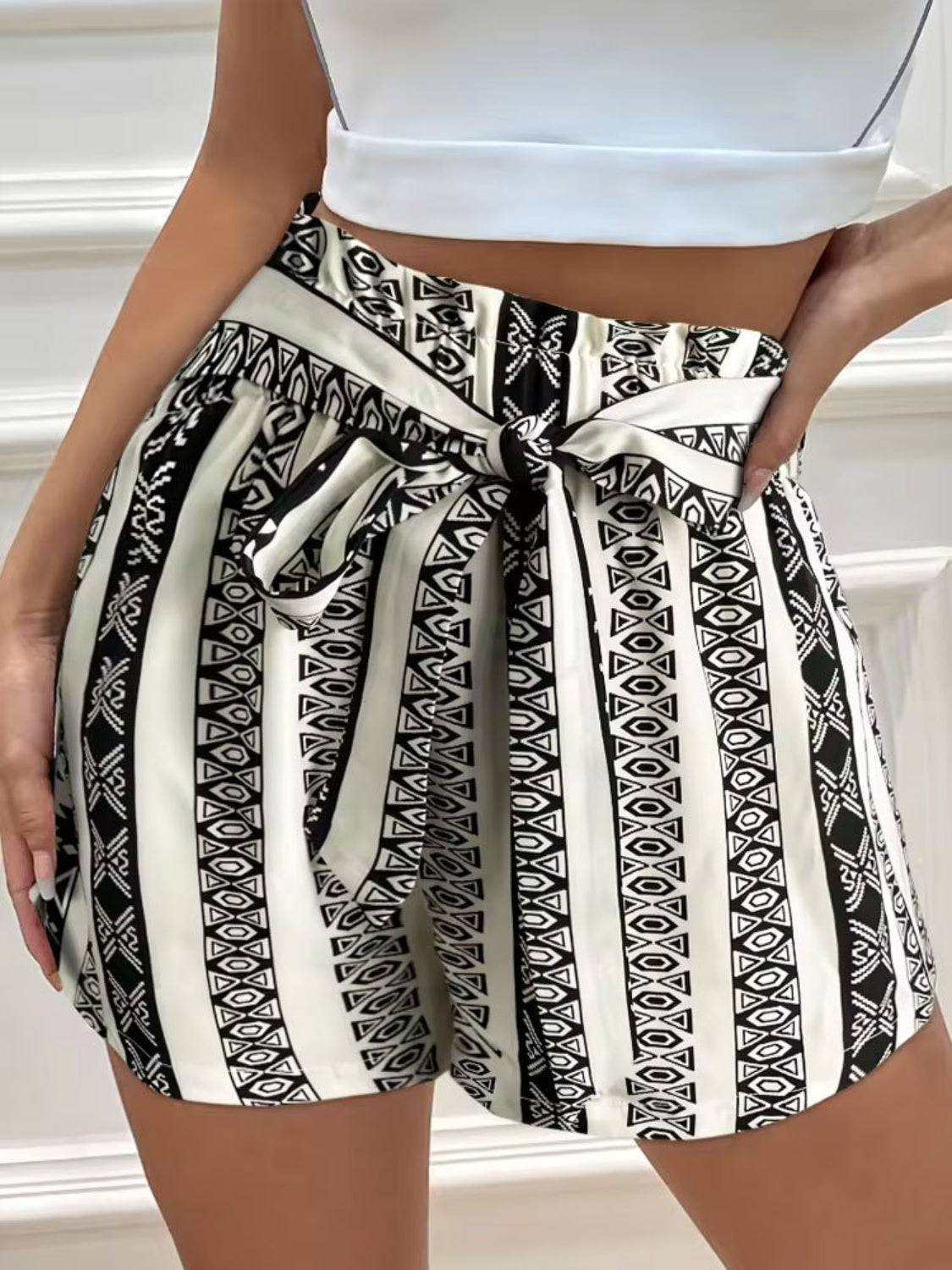 Black and white tied geometric shorts made from polyester.