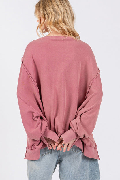 Mineral Wash Side Slit Oversized Sweatshirt with exposed seams and raw edges, back view.