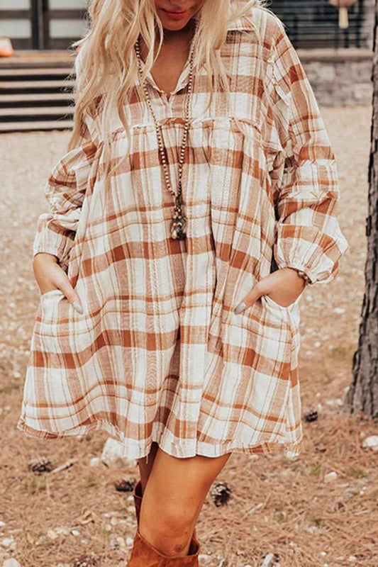 Plaid collared neck long sleeve mini shirt dress in neutral tones.