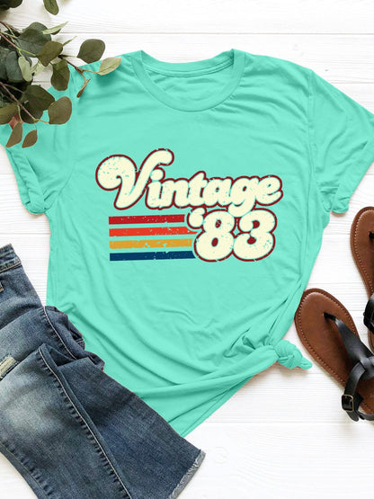 Vintage '83 Graphic T-Shirt in teal with retro design.