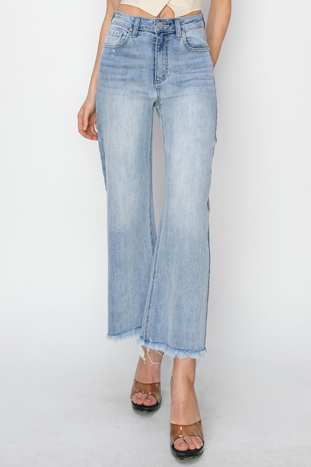 High rise crop wide fray hem jeans with a trendy and modern design.