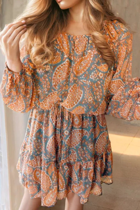 Ruffle hem printed long sleeve dress with paisley pattern, polyester material, machine washable.