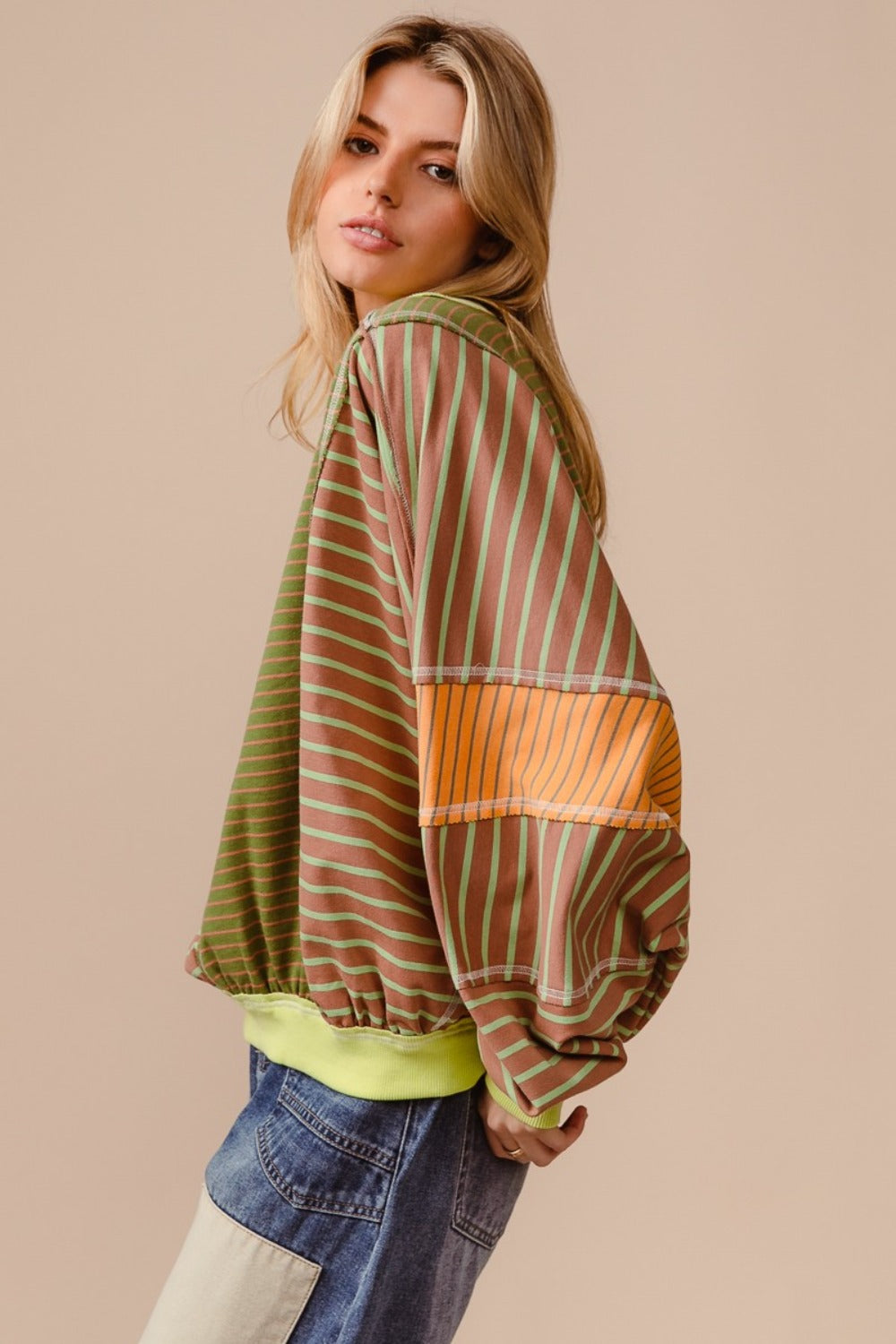 Color Block Striped Round Neck Sweatshirt with bold stripes and exposed seams.