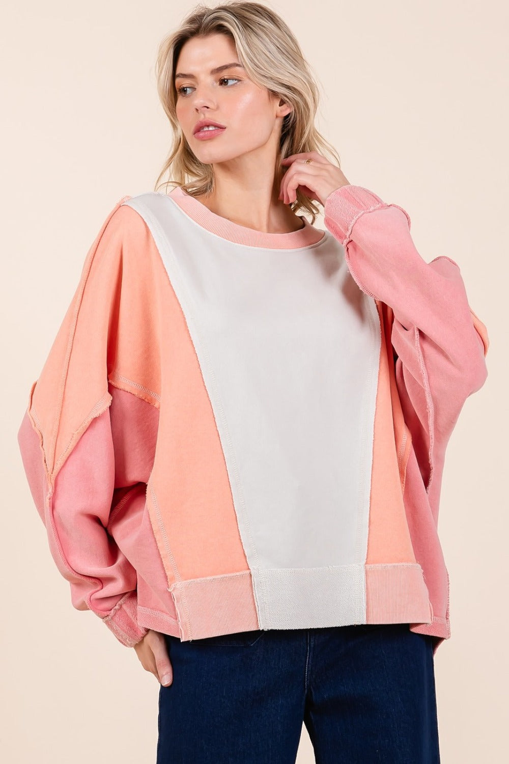 Mineral wash color block sweatshirt with dolman sleeves and exposed seams.