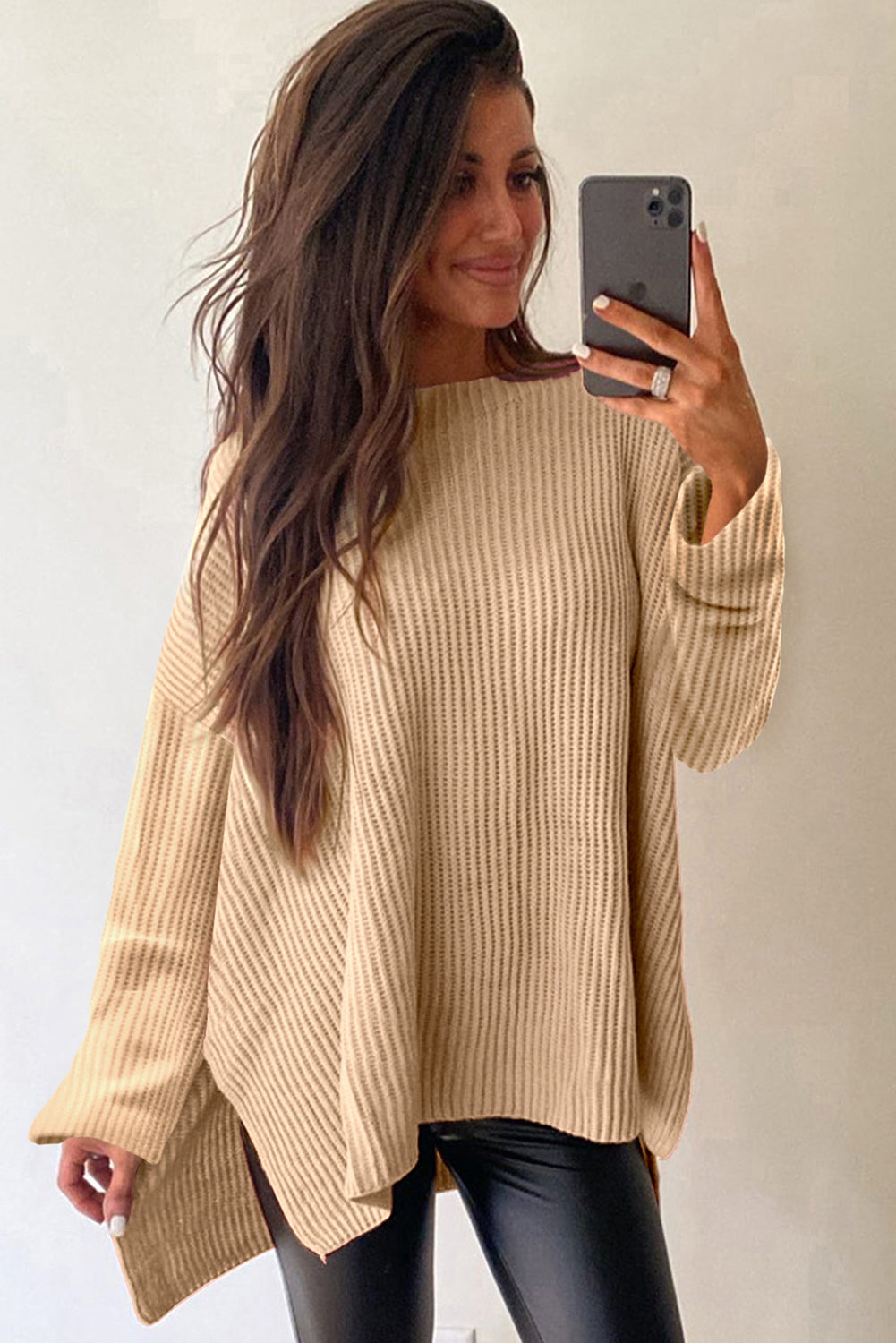 Cozy side slit round neck long sleeve sweater in light brown.