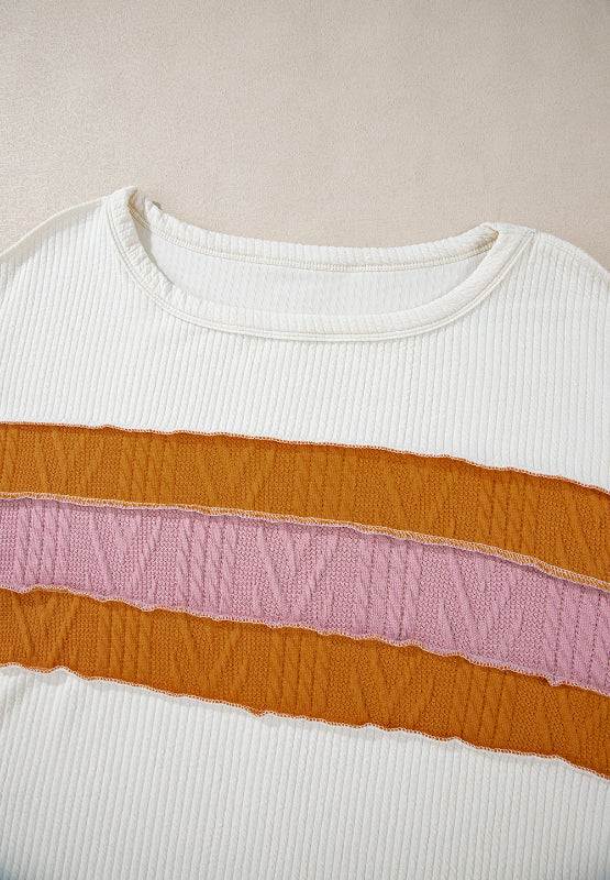 Color block long sleeve sweatshirt with round neck and orange-pink striped design.