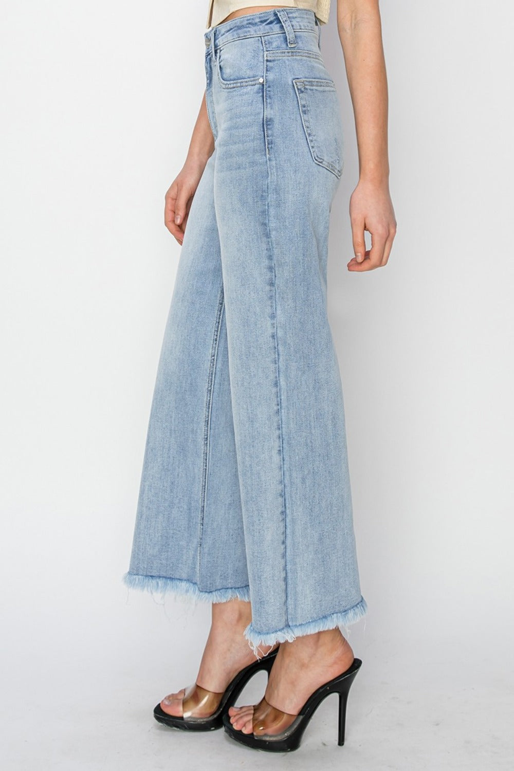 High rise crop wide fray hem jeans with a modern frayed hem and relaxed fit.