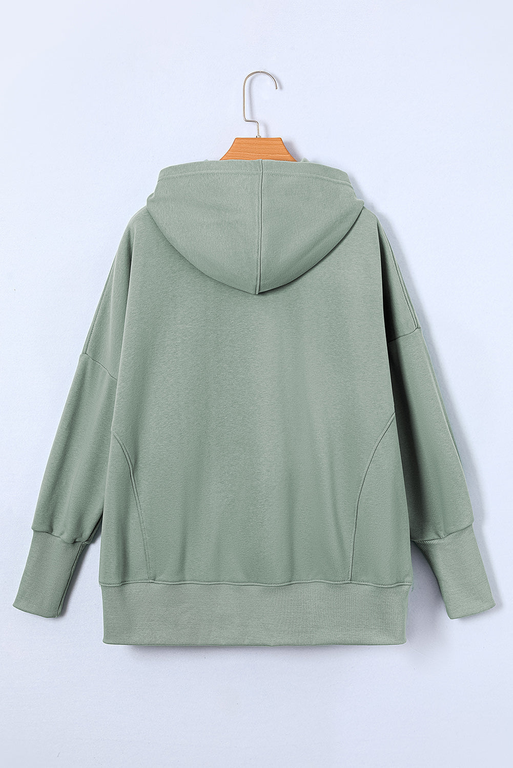 Quarter-Snap Dropped Shoulder Hoodie in green, back view, featuring loose fit and opaque material.