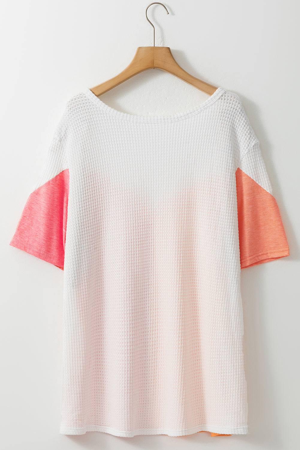 Plus Size Color Block Round Neck Short Sleeve T-Shirt on a hanger.