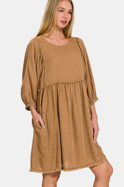 Washed linen pleated puff sleeve babydoll dress with a relaxed and stylish look.