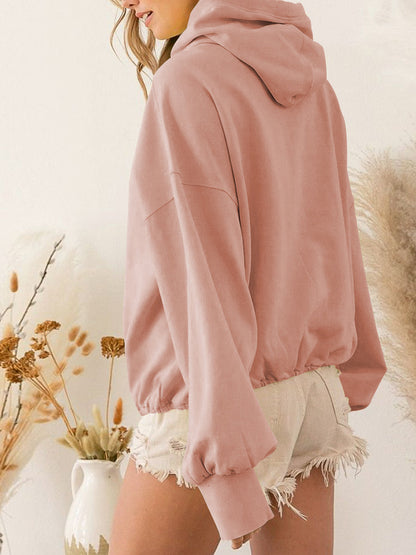 Pink zip-up dropped shoulder hoodie with pockets and drawstring, made from polyester and rayon.