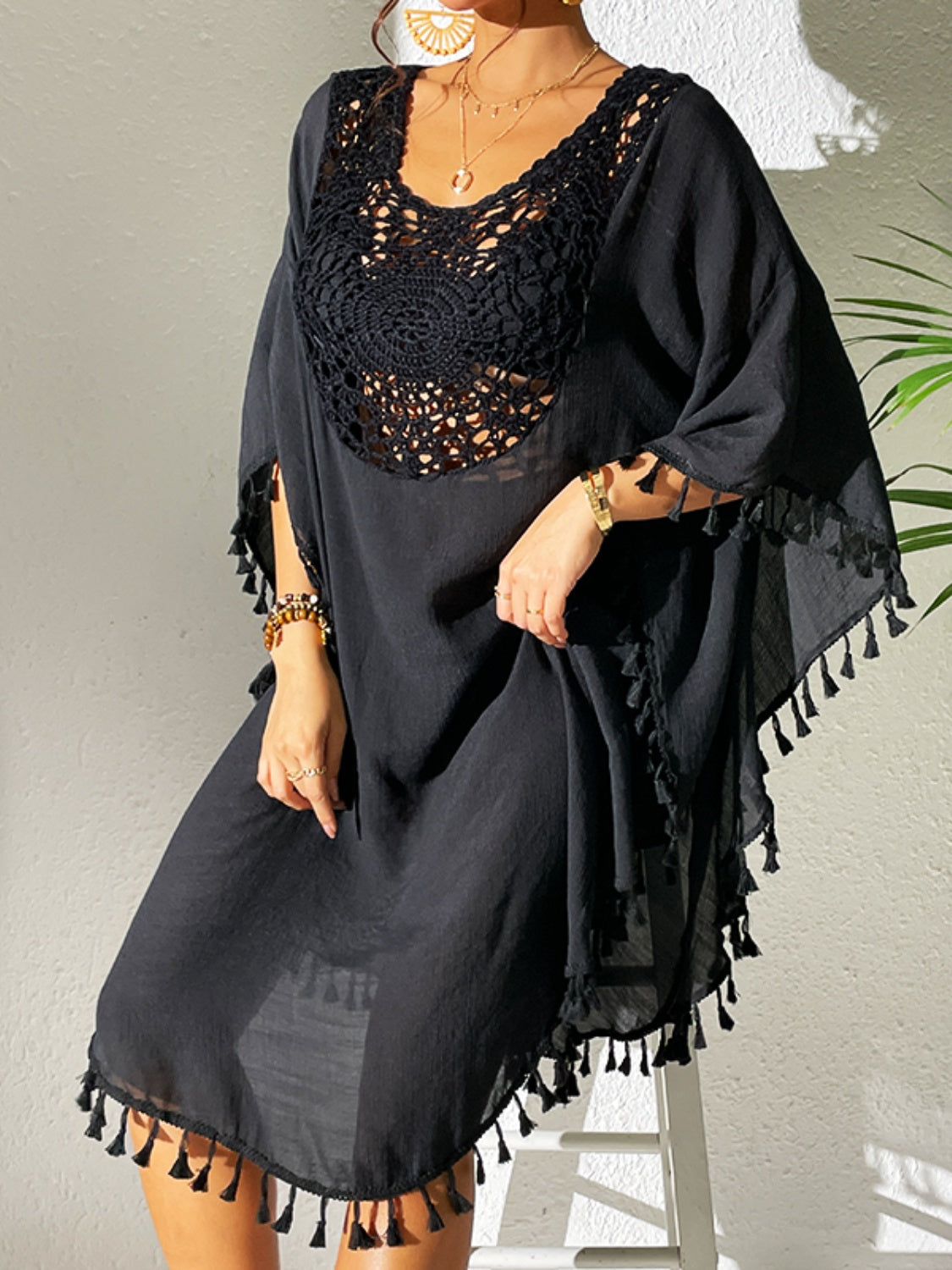 Tassel cutout scoop neck cover-up dress in semi-sheer black fabric.