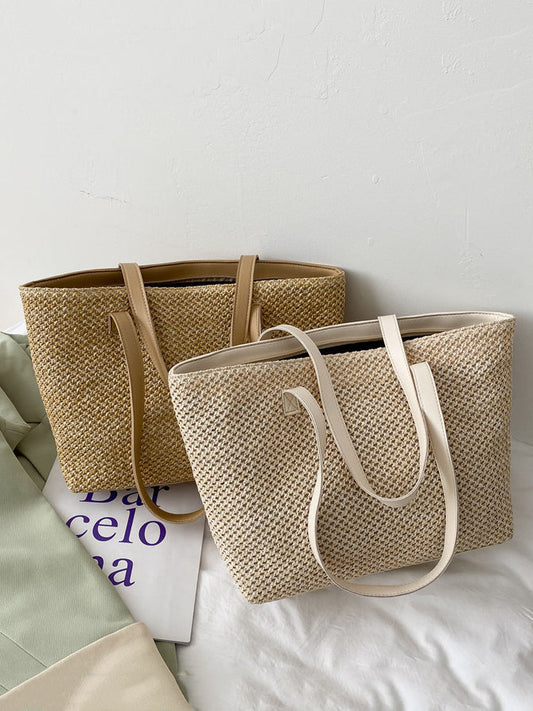 Medium solid color woven tote bag with a stylish design, featuring a spacious interior.