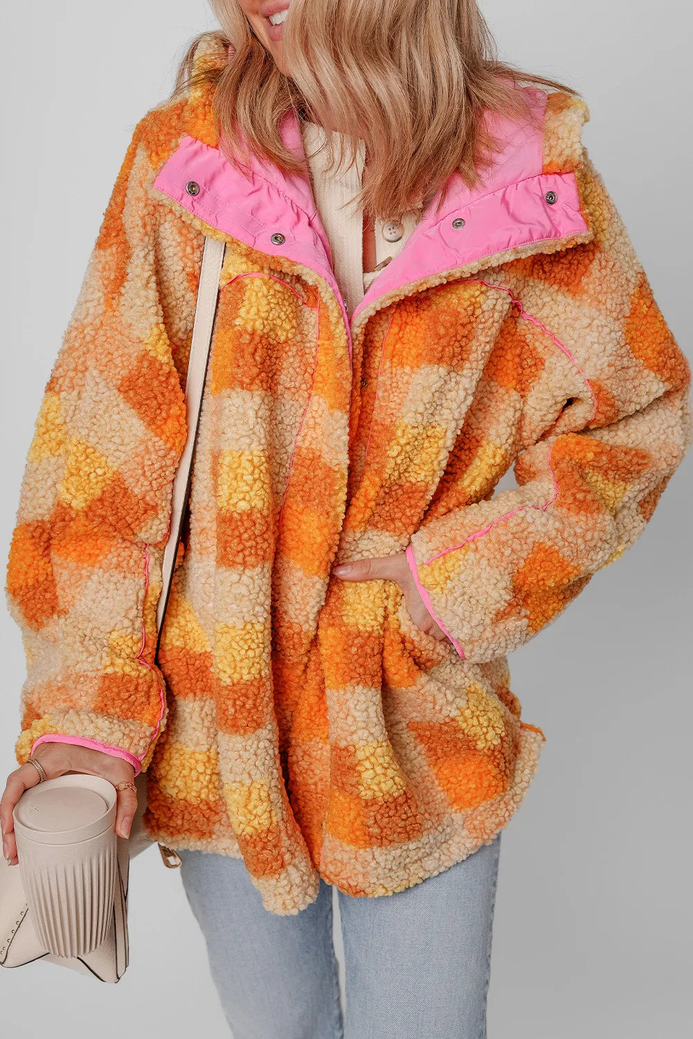 Plaid long sleeve hooded jacket with vibrant orange and pink accents.