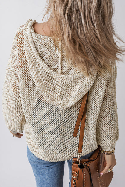 Openwork dropped shoulder hooded knit top with cutout design, shown in beige.