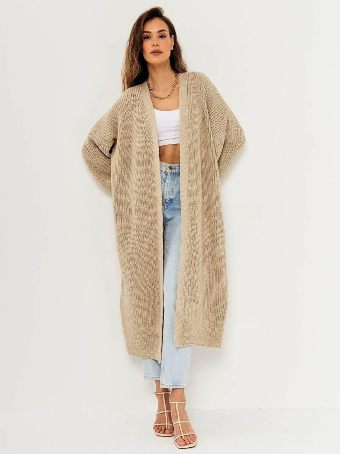 Open front long sleeve longline cardigan in beige with moderate stretch, made from 100% polyester.