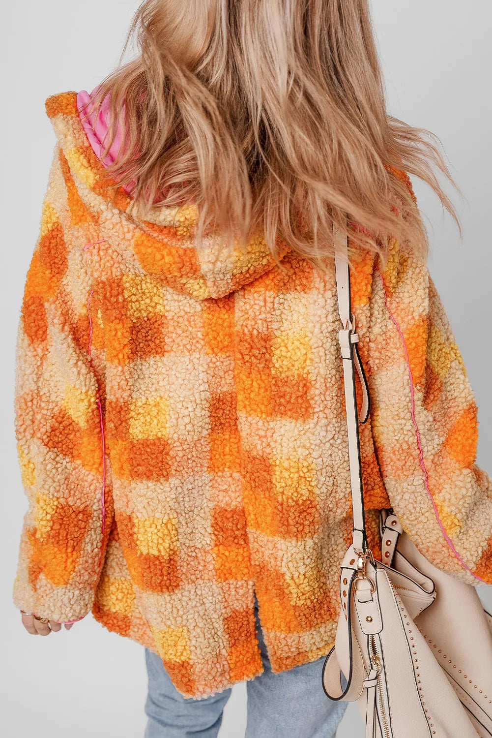 Plaid long sleeve hooded jacket in orange and yellow tones, featuring a cozy lined interior.