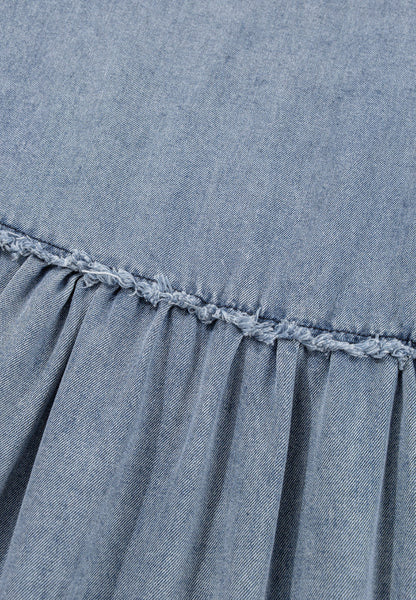 Denim fabric with textured stitching and gathered pleats.