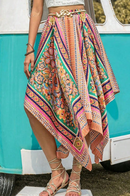 Printed high waist handkerchief hem skirt in vibrant colors.