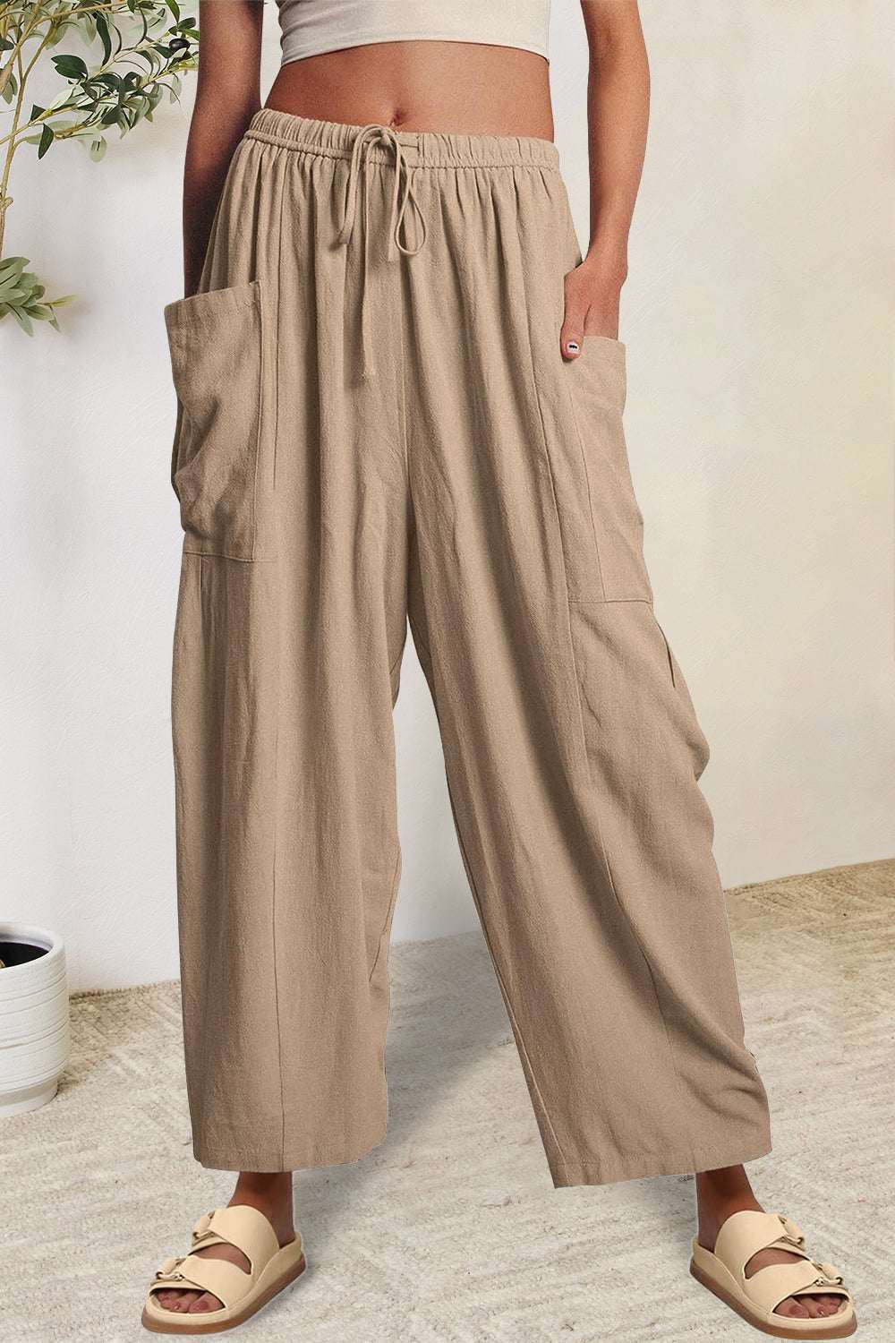 Boho wide leg harem pants with pockets in beige.