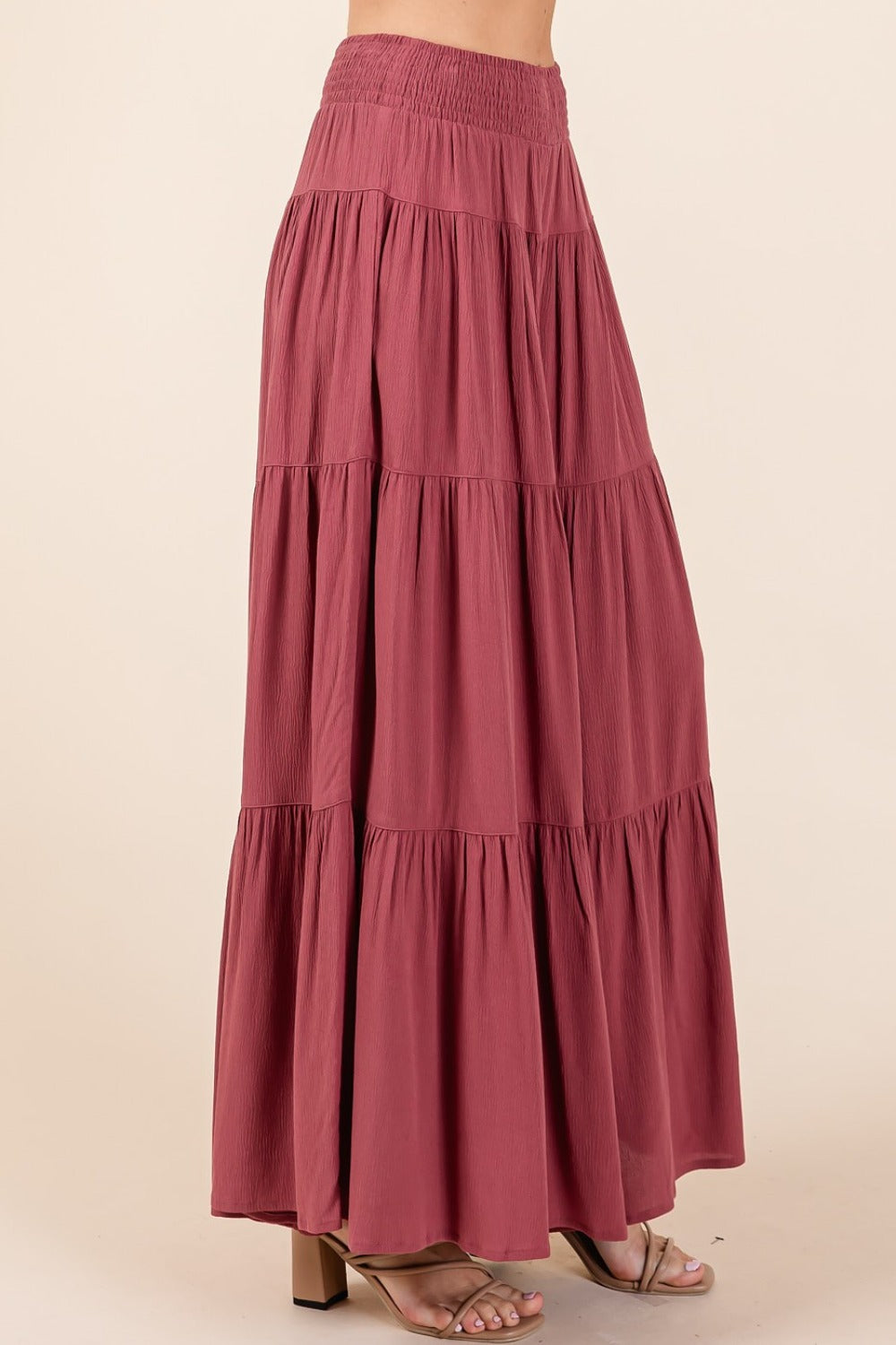 Tier detail smocked elastic waist wide leg pants in lightweight crepe woven fabric.