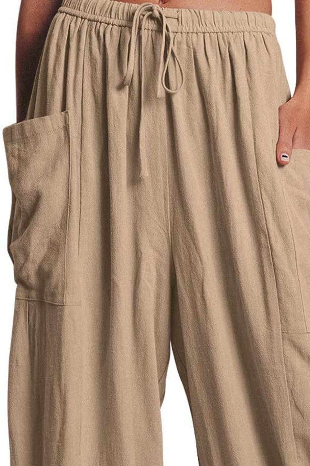 Boho wide leg harem pants with pockets in beige, elastic waistband, 100% polyester.