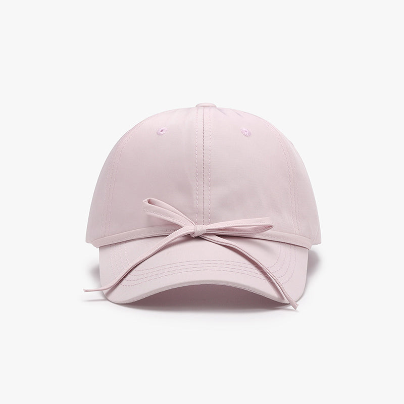 Women's cotton baseball cap with tied bow detail.