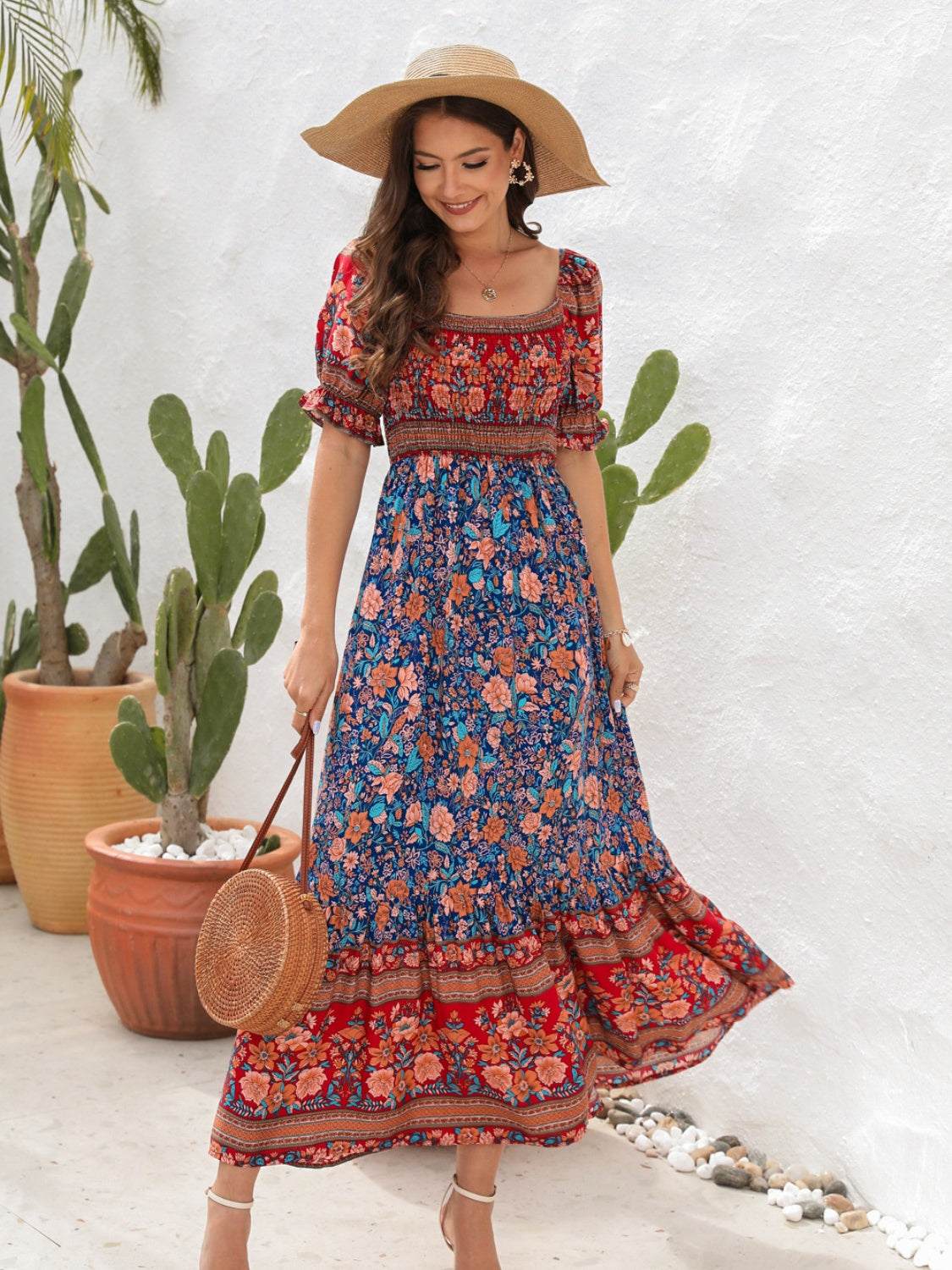 Floral flounce sleeve off shoulder midi dress in vibrant pattern.