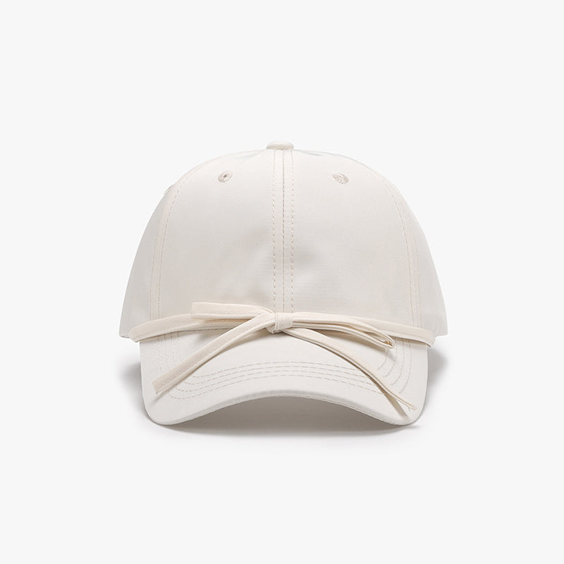 Women's cotton baseball cap with tied bow design.