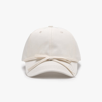 Women's cotton baseball cap with tied bow design.