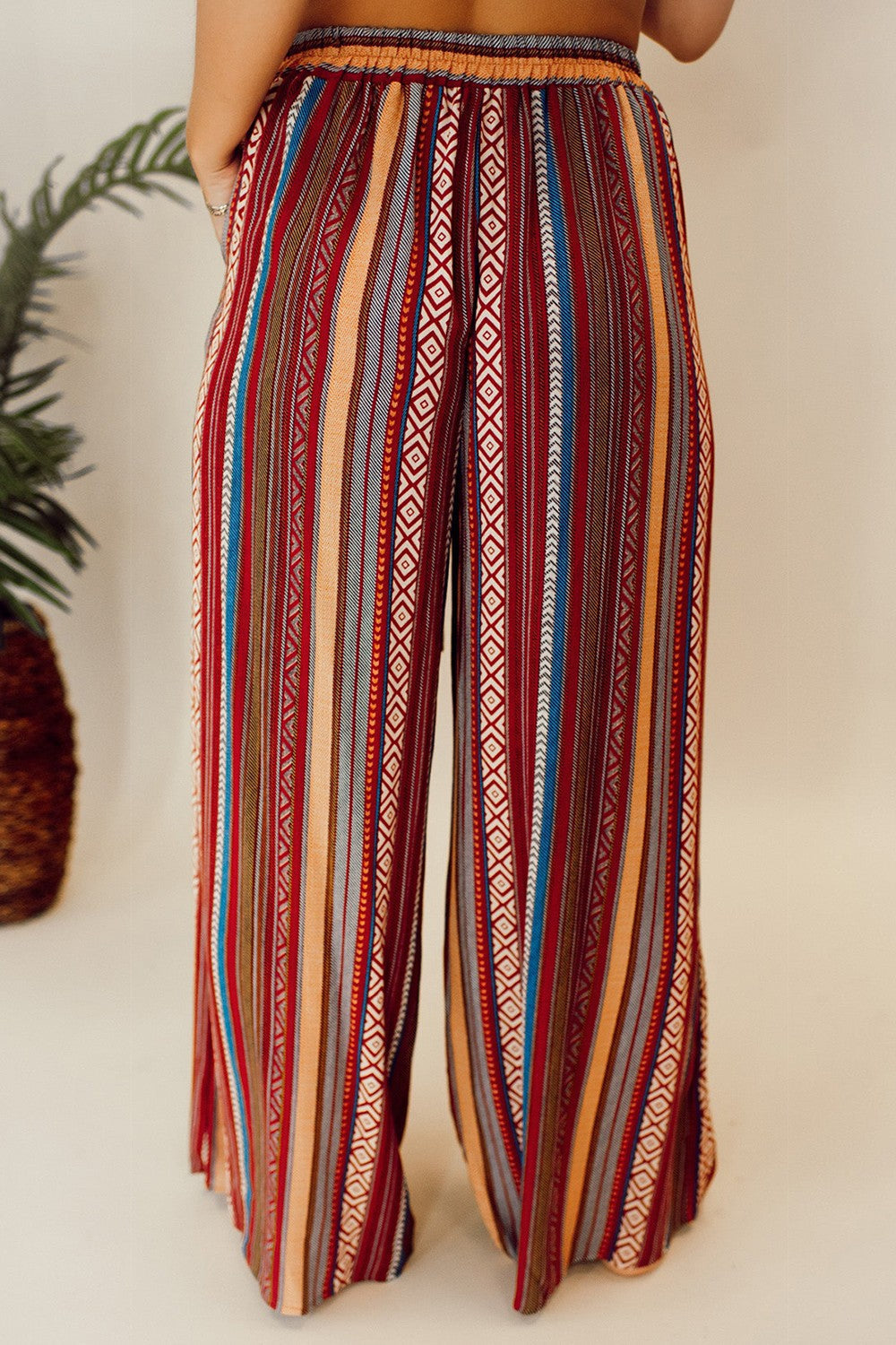 Bohemian stripe wide leg pants for women with high waist, featuring tied pockets.