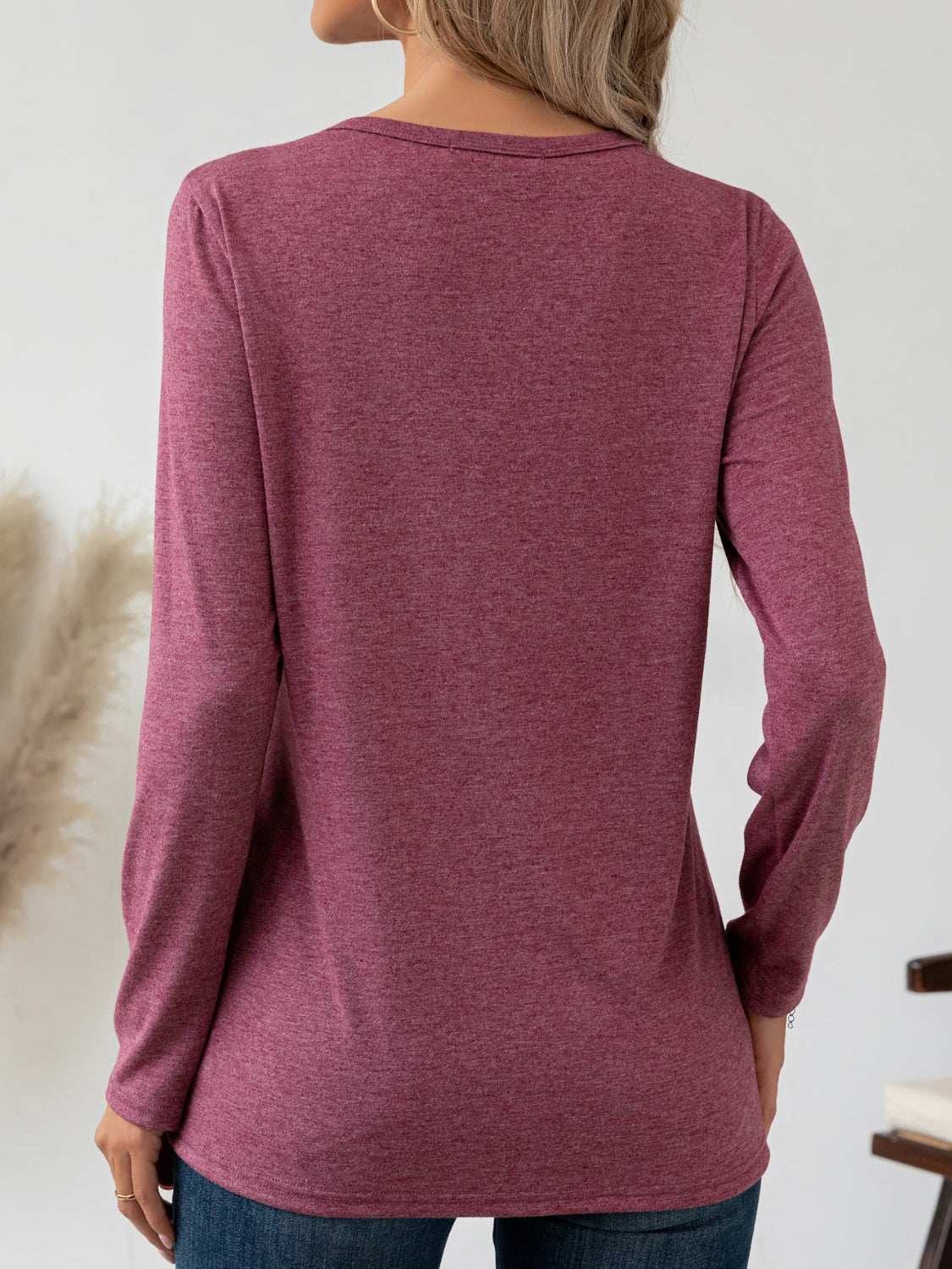 Round neck seam detail long sleeve t-shirt in maroon, back view.