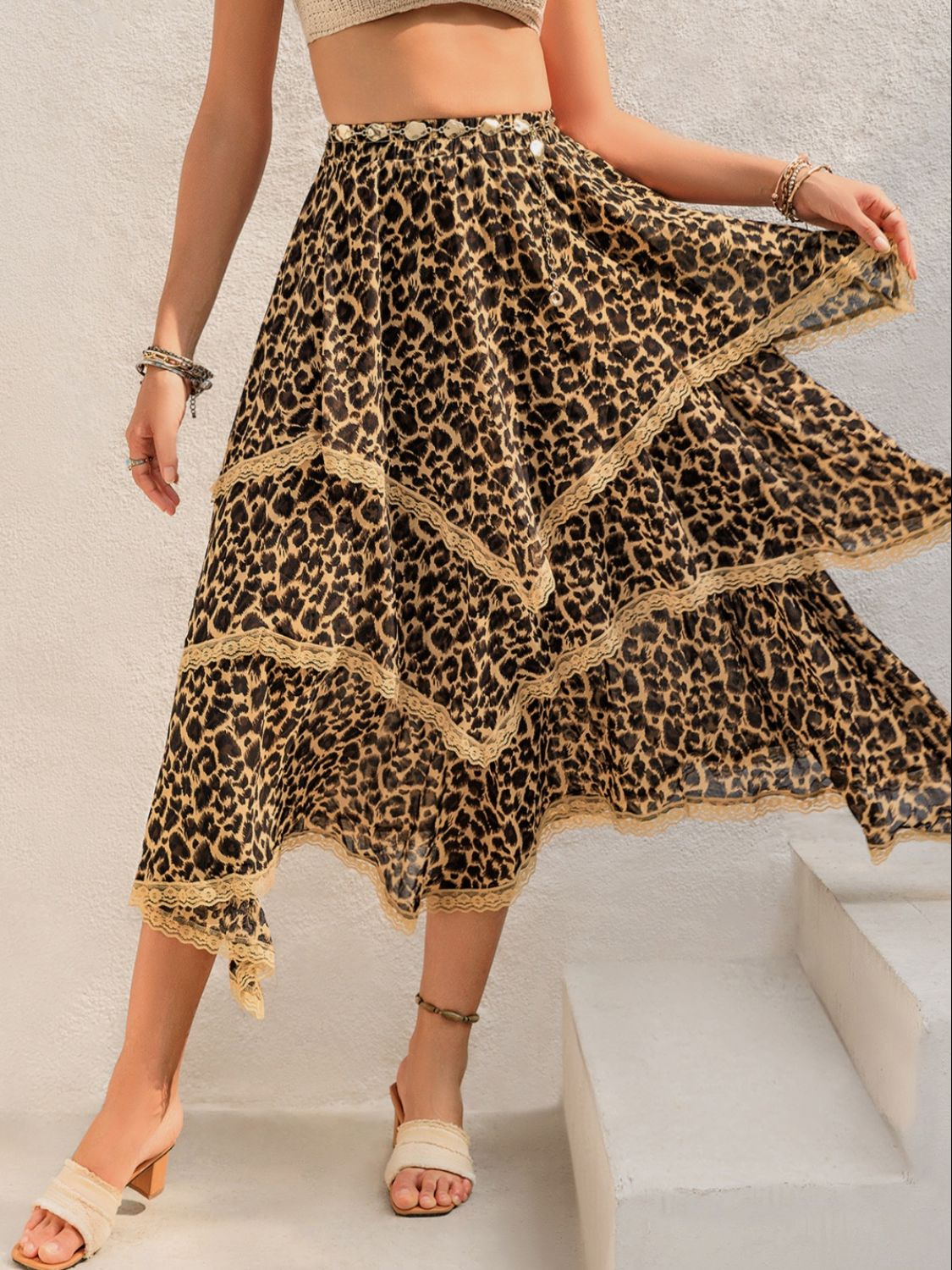 Lace detail layered printed skirt with leopard print design, showing ornate lace accents and flowing layered style.