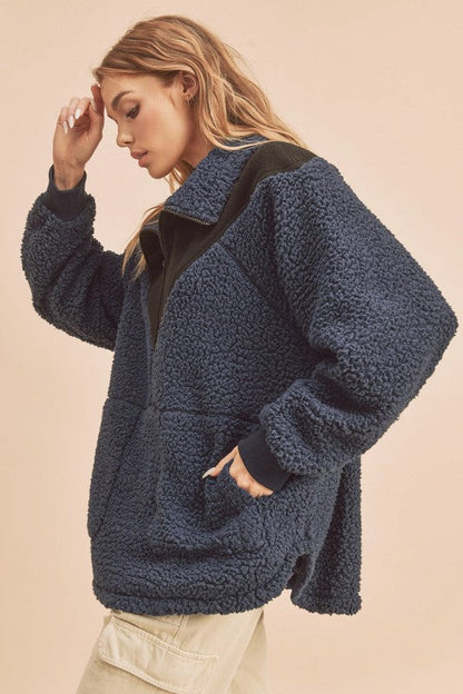 Sherpa oversized two tone half zip fleece pullover sweater with pockets.