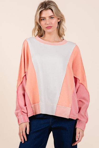 Mineral wash color block sweatshirt with dolman sleeves and exposed seams.