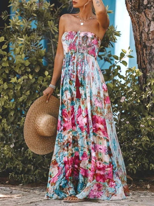 Smocked printed sleeveless maxi dress in vibrant floral pattern with a flowy design.