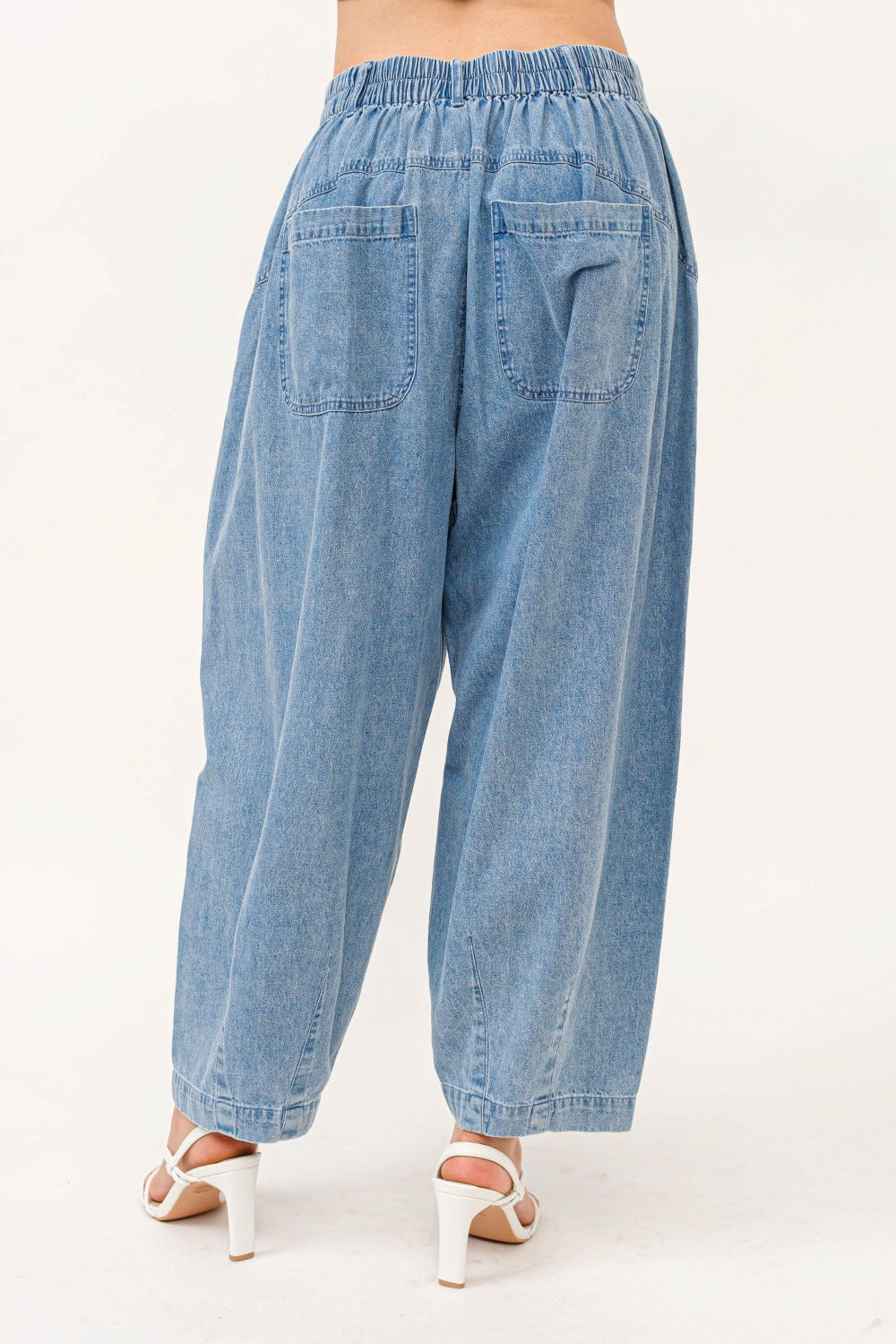 Boho wide leg elastic back pleated baggy jeans with pockets in light blue denim.