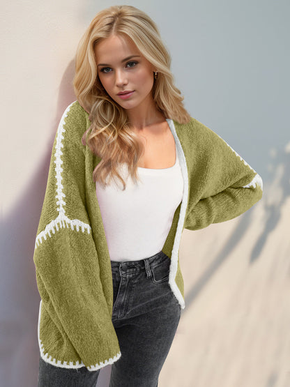 Super Cozy Open Cardigan in green, worn by a woman with a white top and dark jeans.