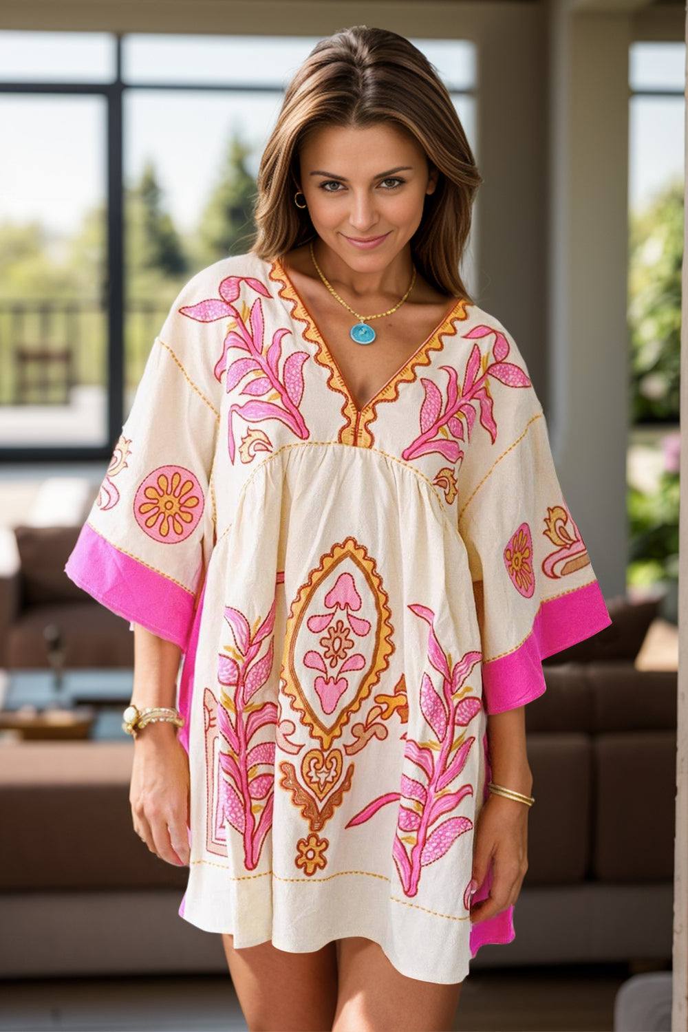 Printed V-neck three-quarter sleeve mini dress in white with pink and orange floral patterns, made of 100% polyester.